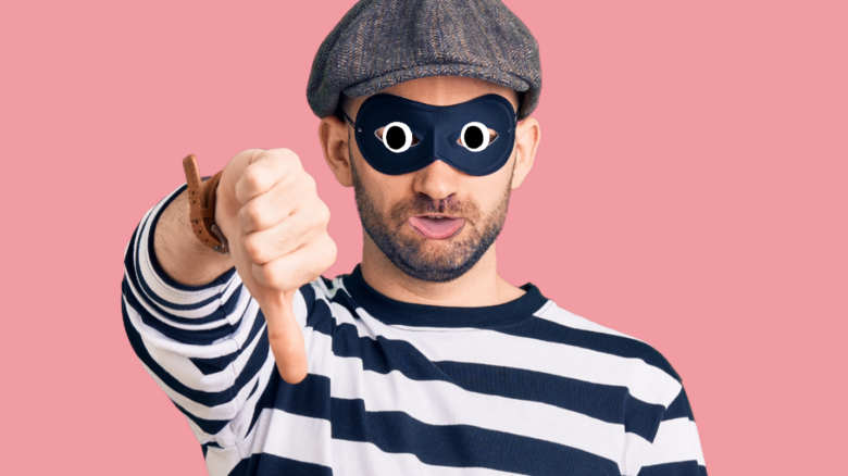 A burglar giving the thumbs down