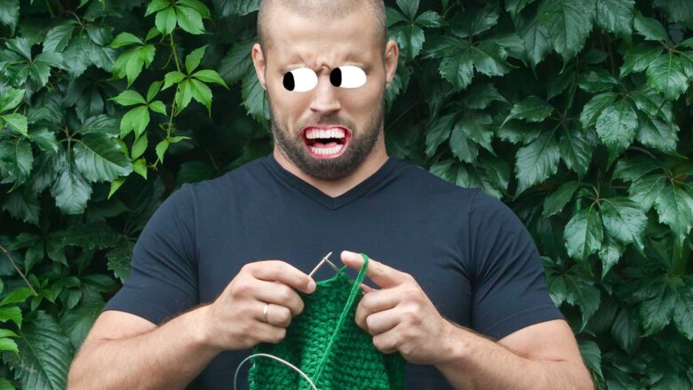 A man doing knitting next to a hedge