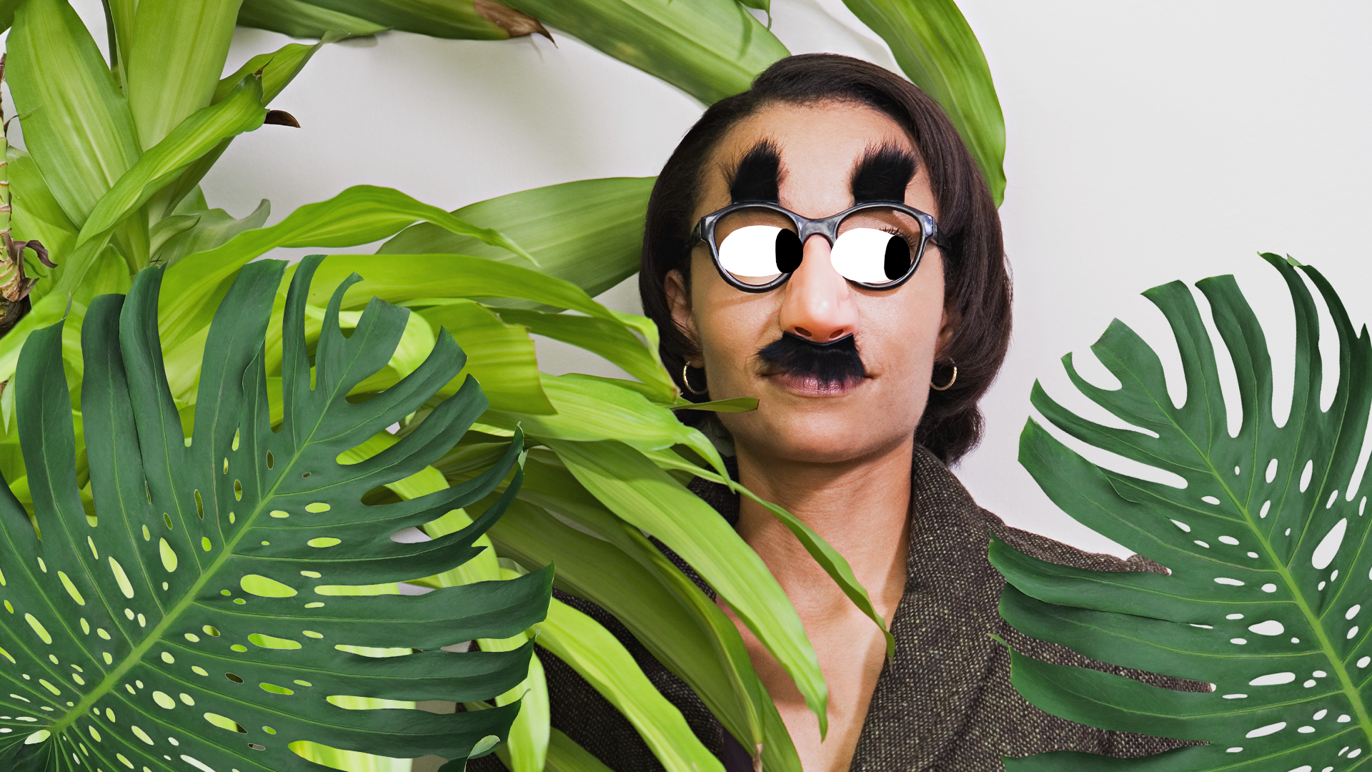 Woman with disguise hiding in bushes
