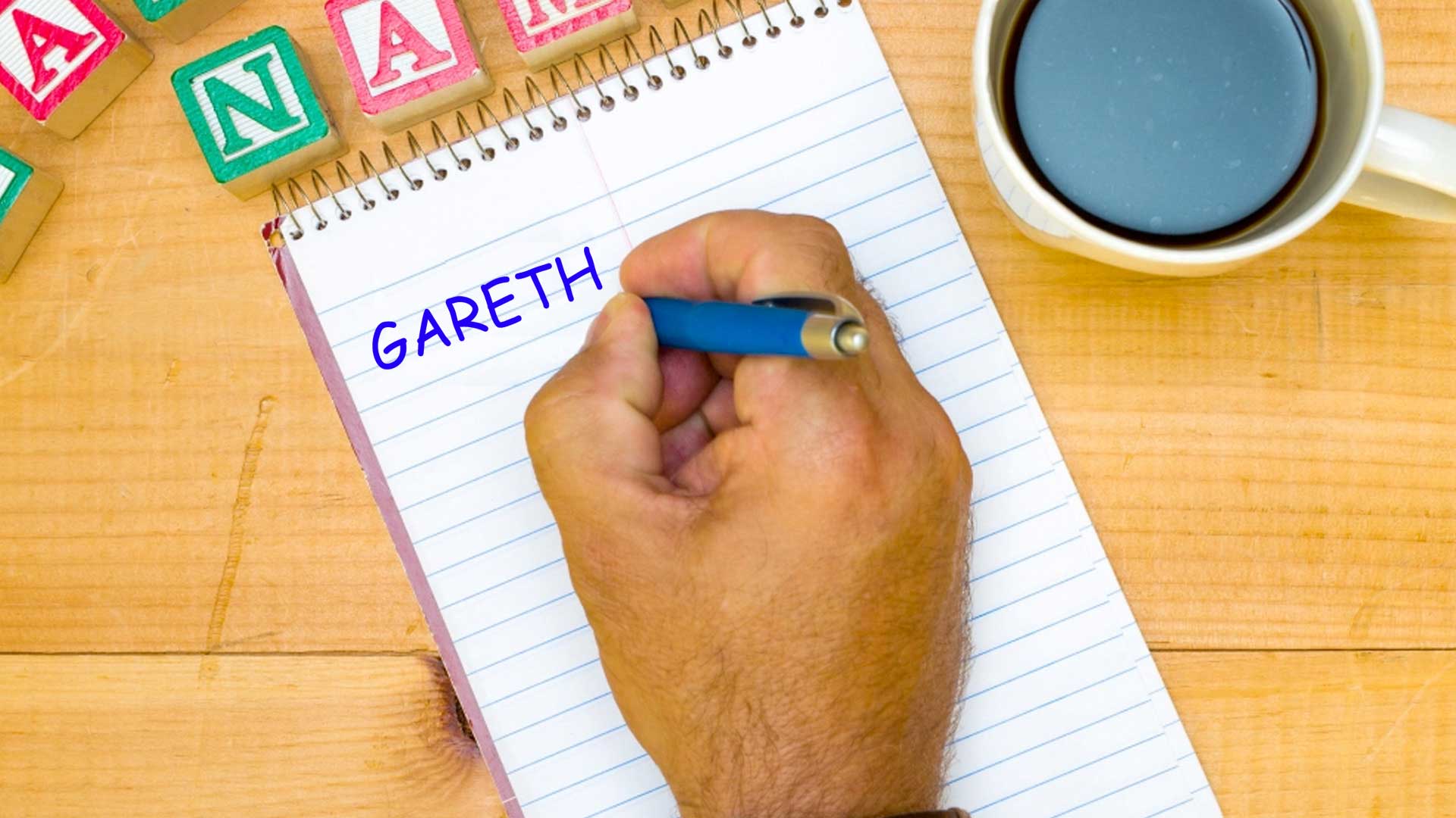 A man writing down the name Gareth