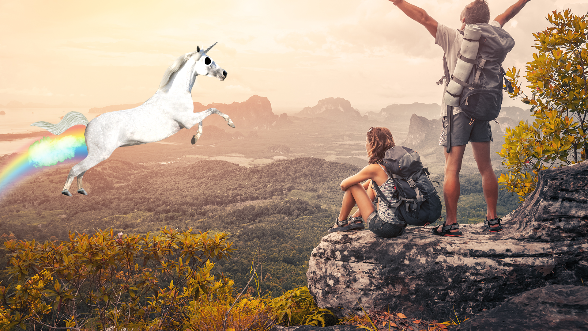 Two hikers looking at mountain scene with flying unicorn