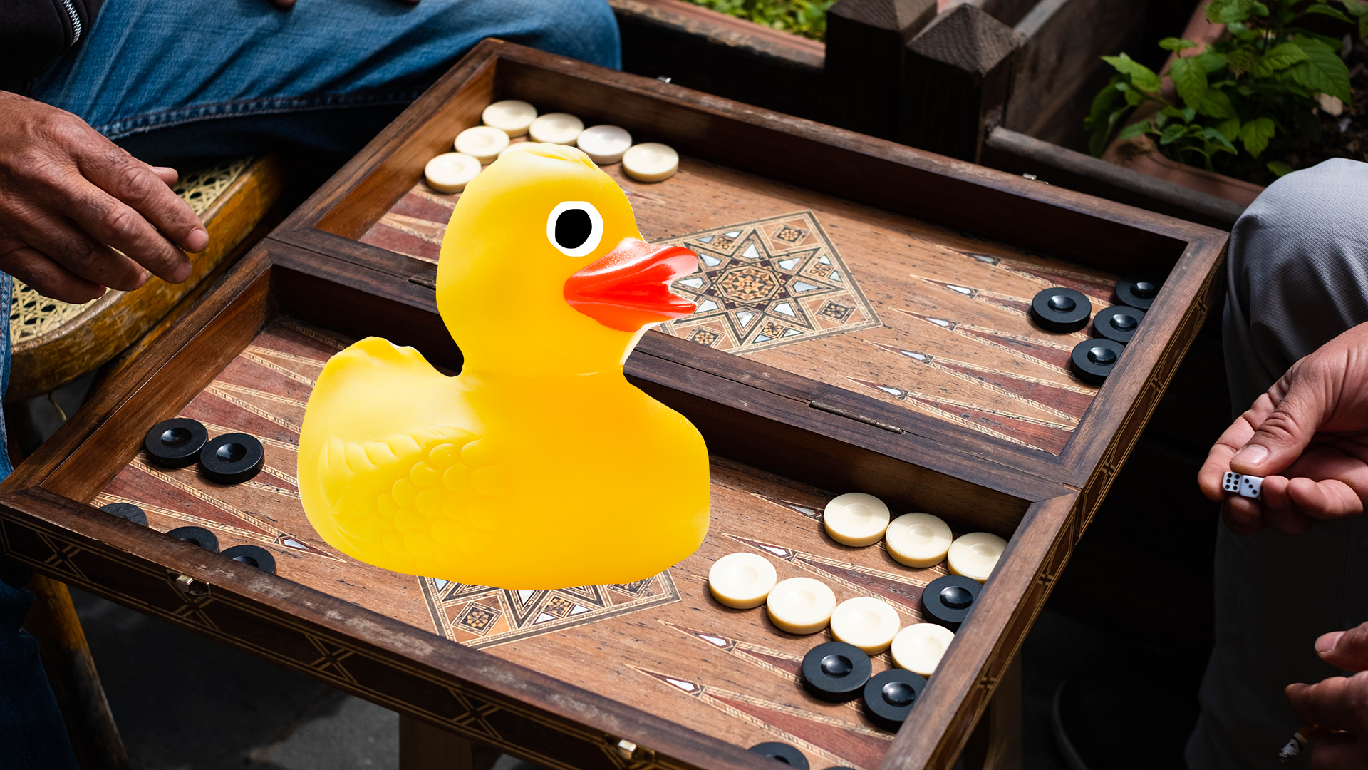 Rubber duck on a backgammon board