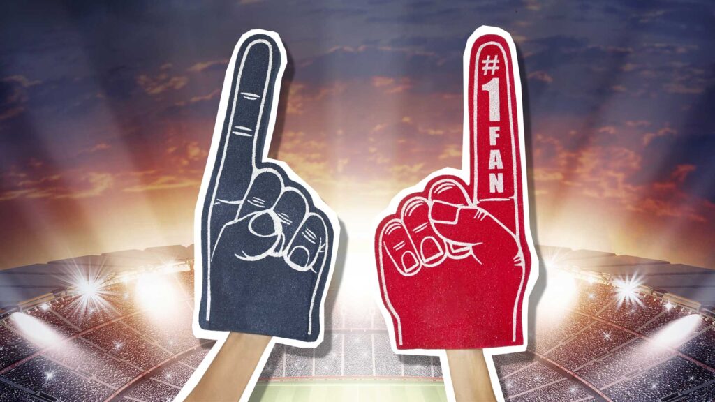 Red and blue foam hands with a stadium