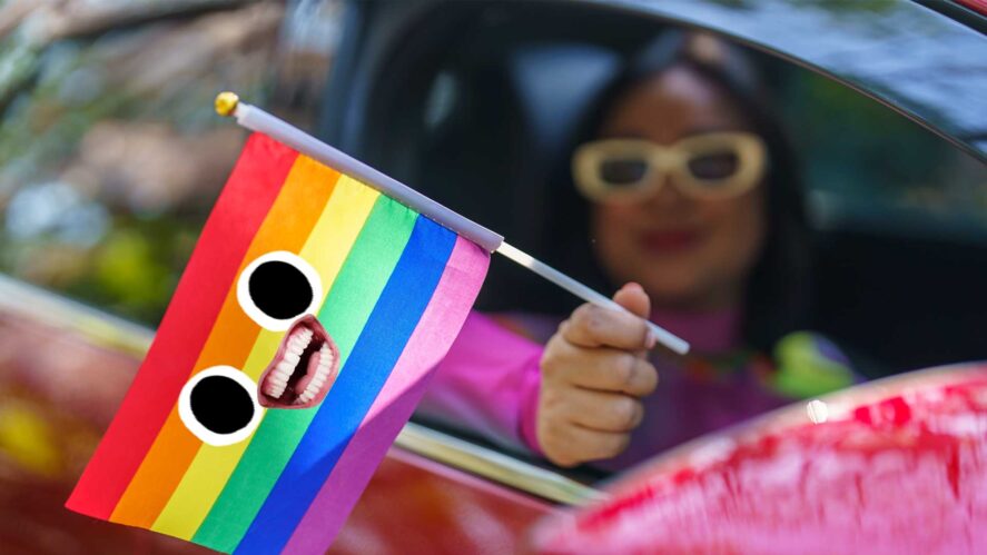 A pride flag waved from a car