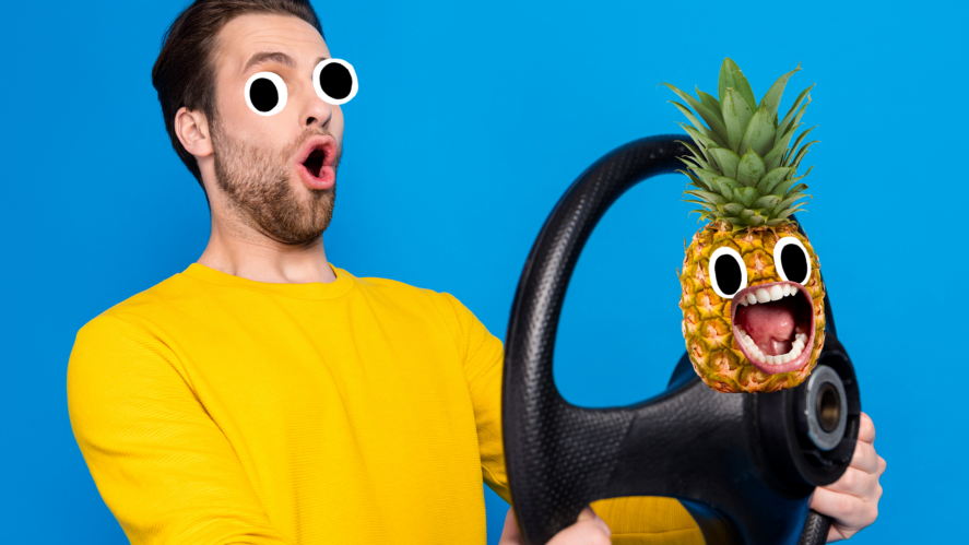 Man with steering wheel and screaming pineapple