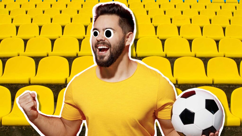 A happy football fan in a yellow shirt