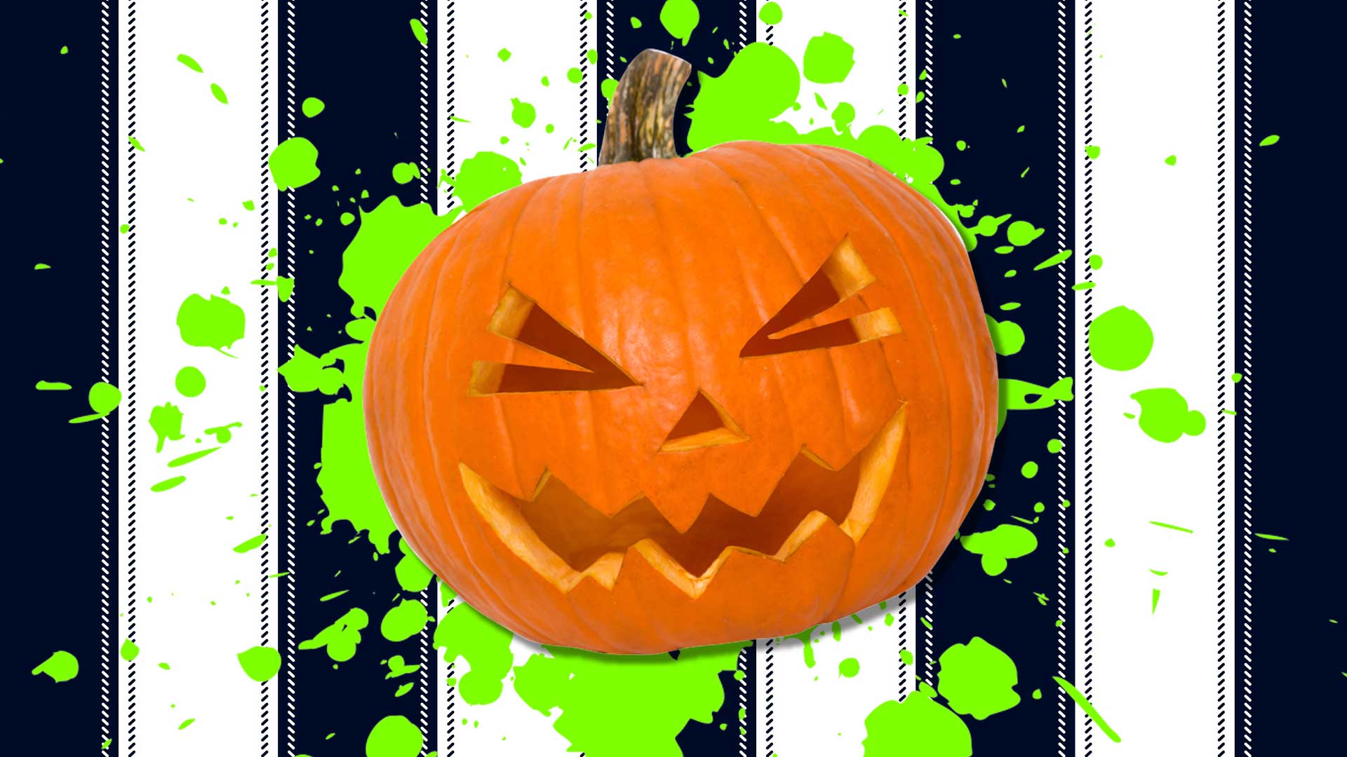 A pumpkin on a black and white striped background