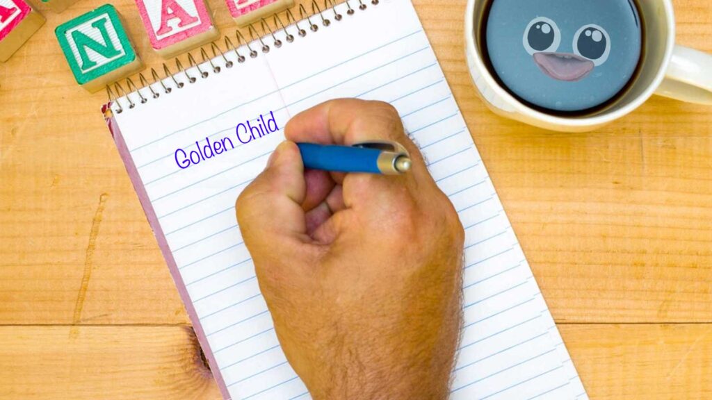 A man writing Golden Child on a notepad 