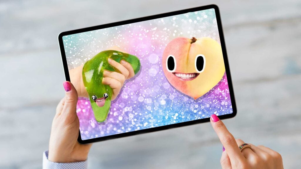 A woman watching slime on iPad