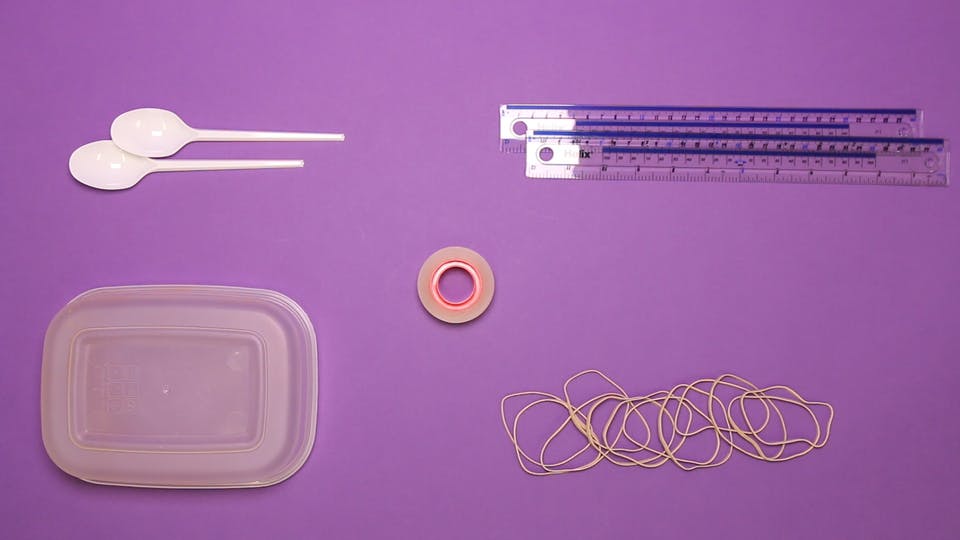 You will need - a plastic tub, 2 rulers, sticky tape, rubber bands, paper clips