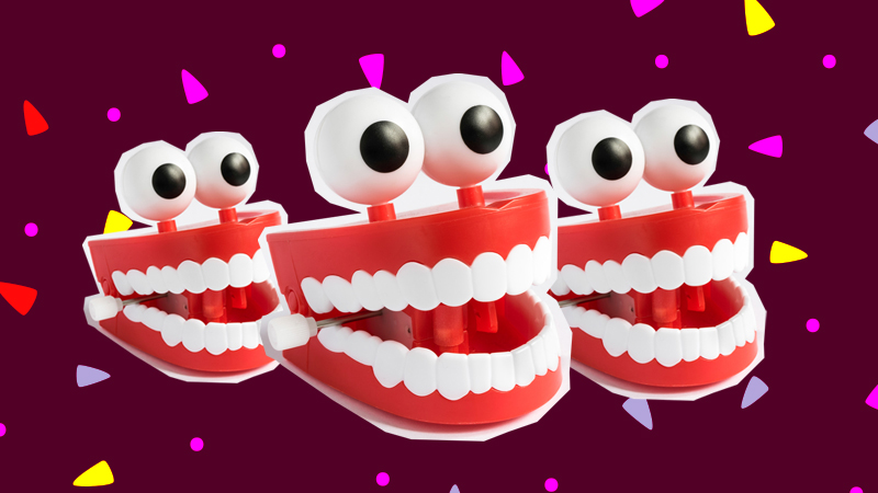 Three chattering teeth toys with googly eyes attached on top